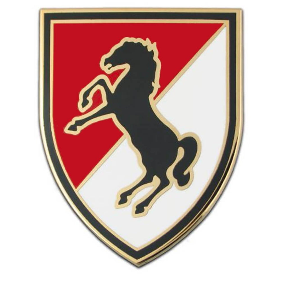 11th Armored Cavalry Combat Service Identification Badge a shield-shaped emblem featuring a black rearing horse over a diagonally split red and white background, outlined in black with a gold border.