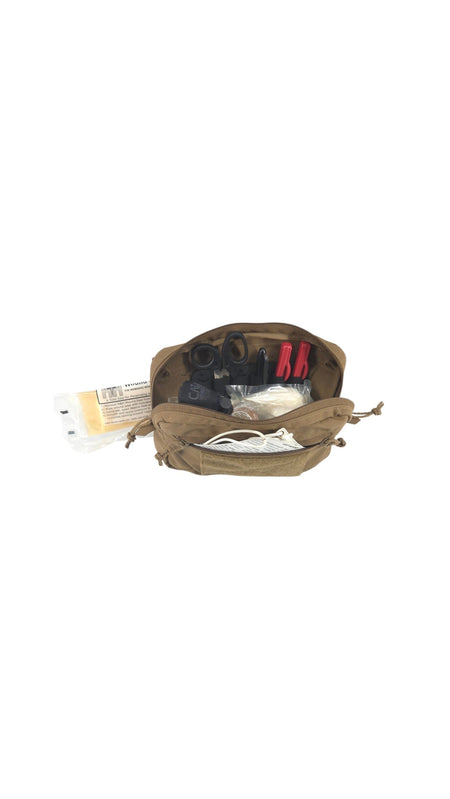 An open tan utility pouch or first aid kit organizer on a plain white background, showing various medical and utility items inside including red-handled tools, white cords, and packaged supplies.