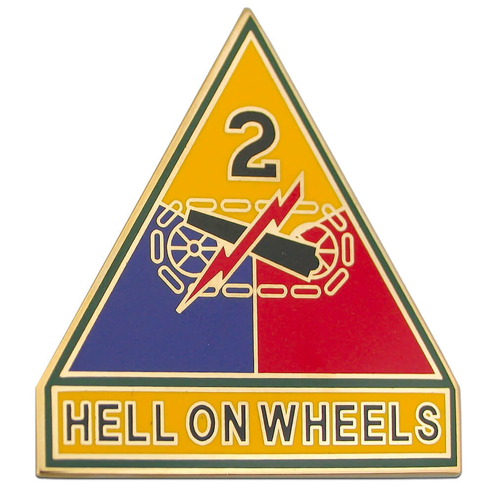A triangular enamel pin or badge with a yellow border and the text 'HELL ON WHEELS' across the bottom. The top half is yellow with a black number 2, and the bottom half is split into blue and red sections with a crossed black and red diagonal motif.