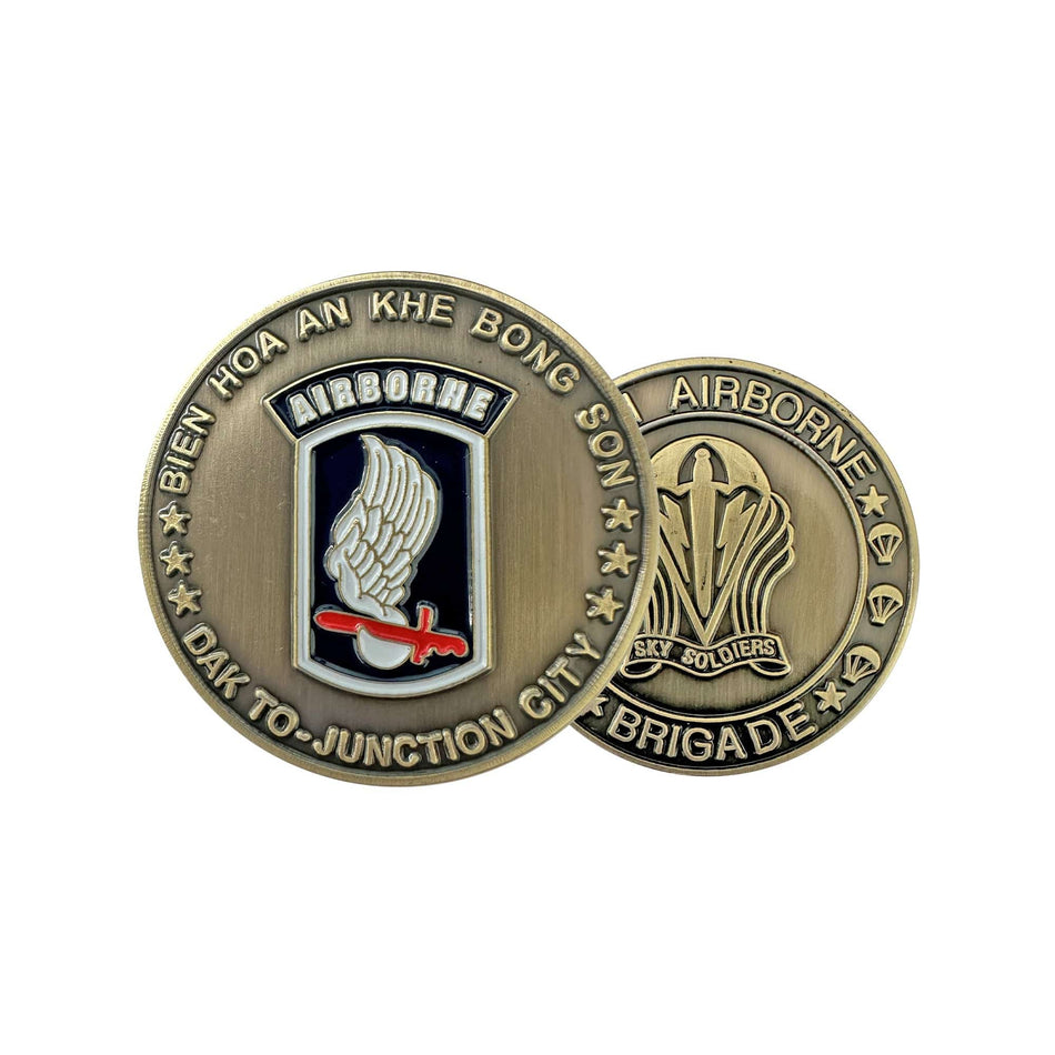 Bronze military challenge coin with emblem and text on a white background