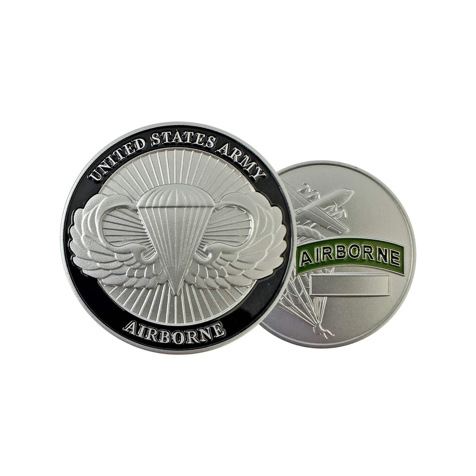 Two sides of a United States Army Airborne coin on a white background