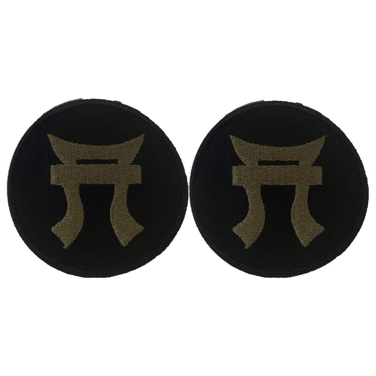 Two black round patches with a gold symbol on a white background