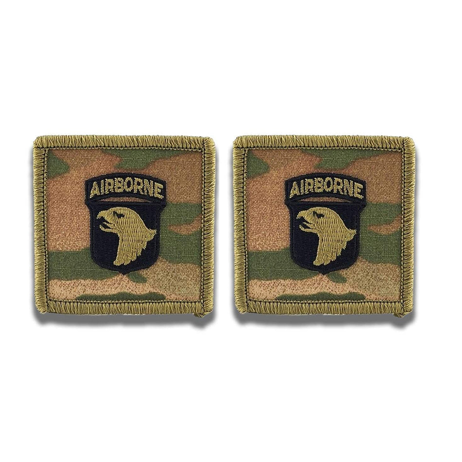 Two military patches with 'Airborne' insignia on a camouflage background