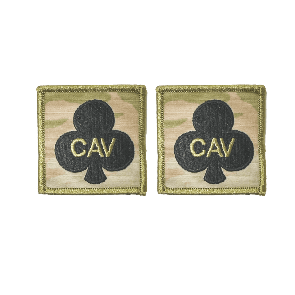 Two military patches with 'CAV' text on a white background