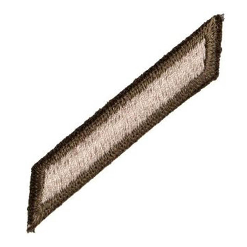 A rectangular embroidered patch with a diagonal orientation, featuring a dark brown border and a light beige center on a plain white background.