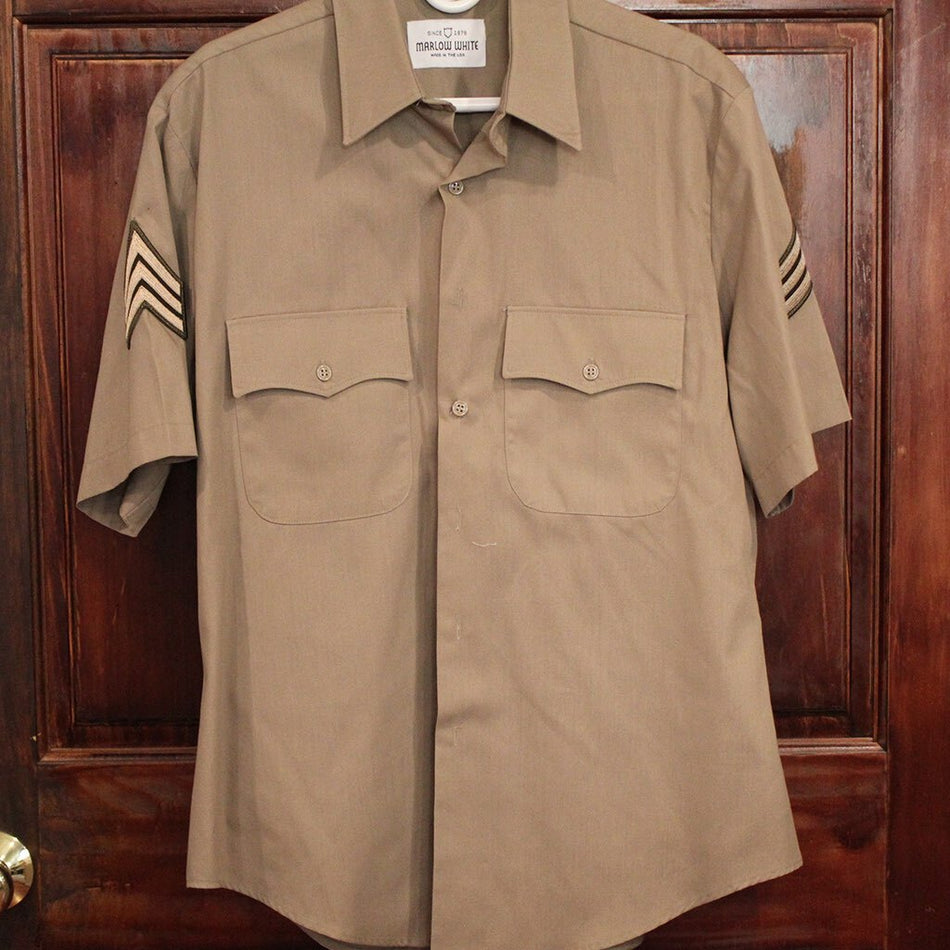 AGSU Short Sleeve Dress Shirt For Males hanging on a door