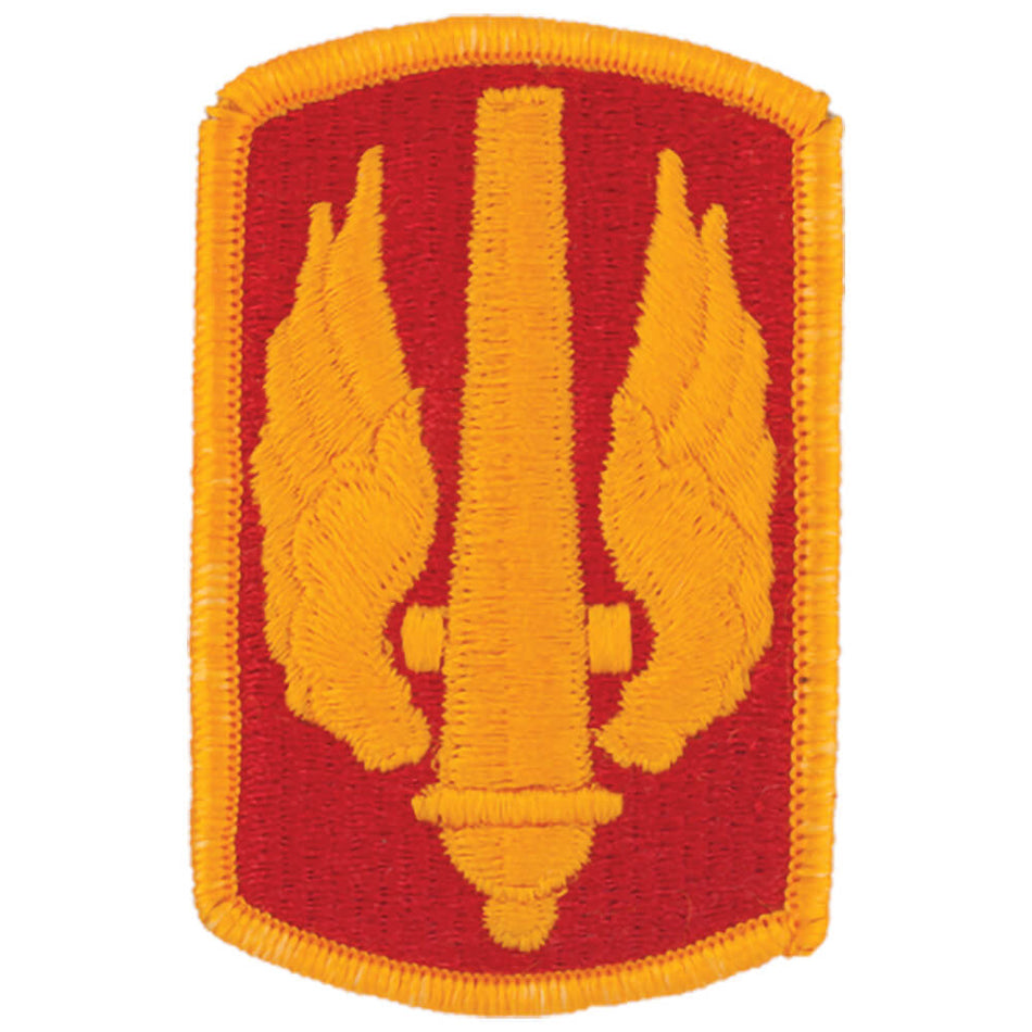 18th Field Artillery Brigade Color Army Patch an embroidered military-style patch featuring a red shield shape with a yellow border, a central yellow vertical element, and two yellow wings on each side, shown on a plain white background.