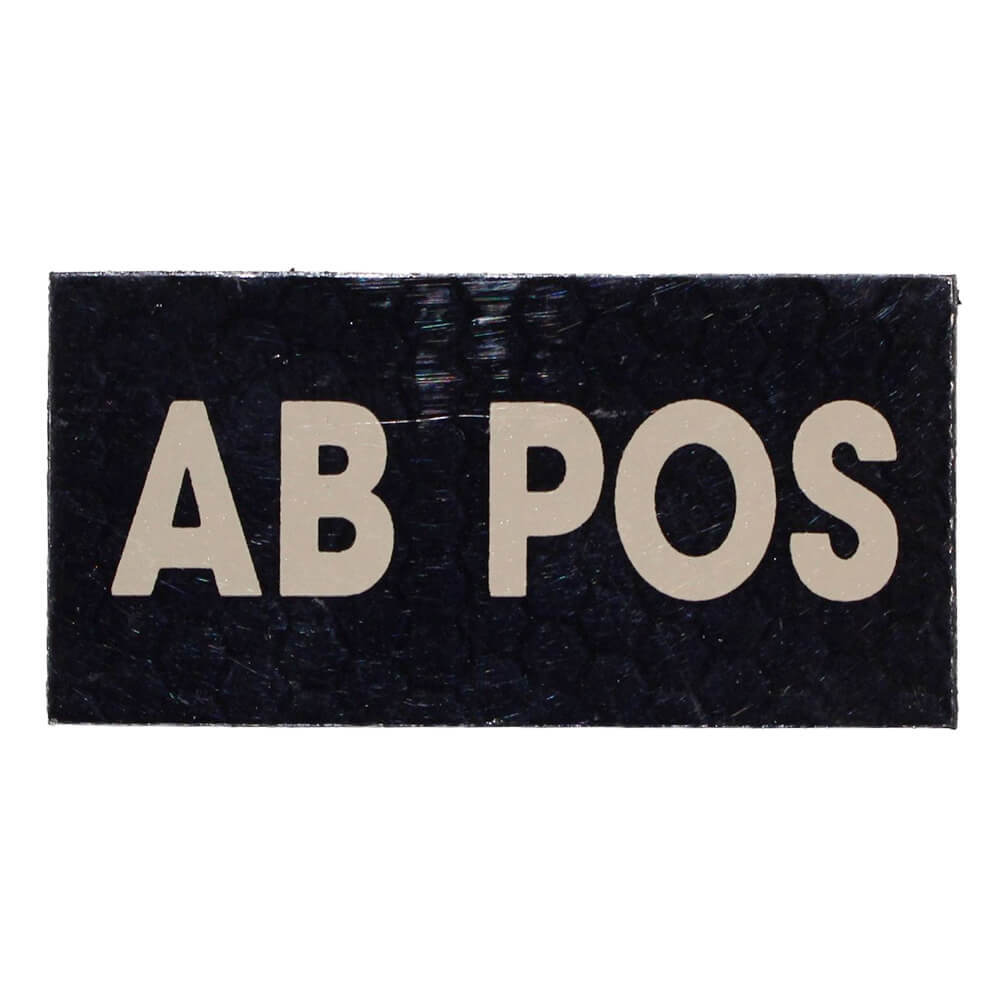 A rectangular black patch with the text 'AB POS' in large beige capital letters, shown on a plain white background.