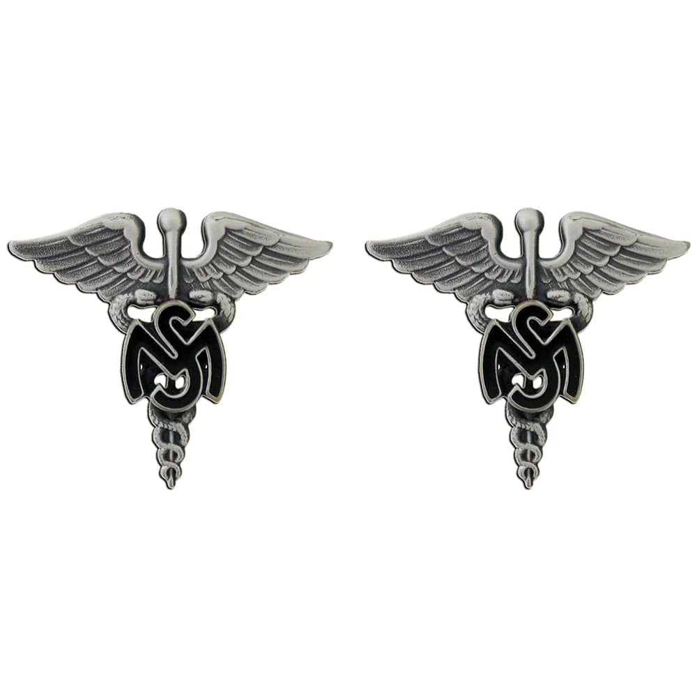 A pair of silver-toned military-style lapel pins featuring a caduceus winged emblem with a black swastika symbol in the center, set against a plain white background.