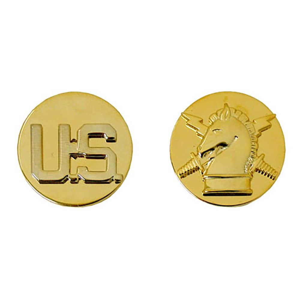 Two round gold military insignia pins on a white background, one showing the letters 'US' and the other showing the Marine Corps emblem.