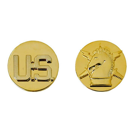 Two round gold military insignia pins on a white background, one showing the letters 'US' and the other showing the Marine Corps emblem.