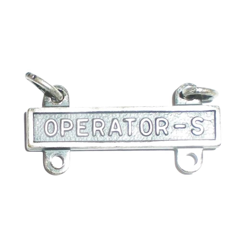 A silver-toned metal bar pendant with the words 'OPERATOR-S' engraved across the center, featuring two small loops at the top and two mounting holes on the bottom, shown on a plain white background.