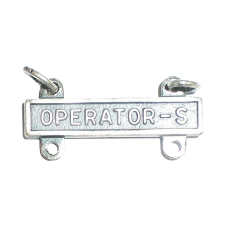 A silver-toned metal bar pendant with the words 'OPERATOR-S' engraved across the center, featuring two small loops at the top and two mounting holes on the bottom, shown on a plain white background.