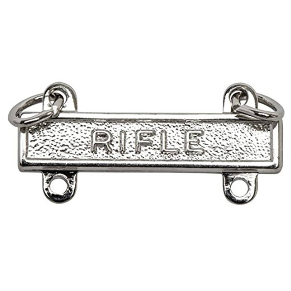 A silver-toned metal rifle receiver emblem or charm with the word 'RIFLE' embossed in the center, shown on a plain white background.