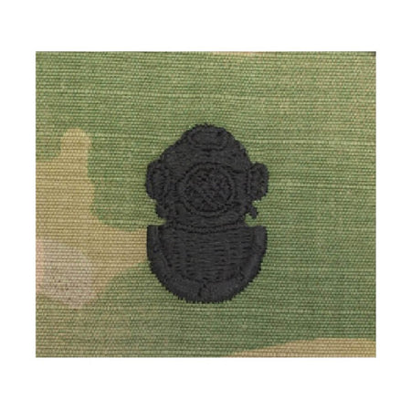 Army 2nd Class Diver OCP Sew-On Patch A black embroidered patch shaped like a vintage diving helmet, shown on a green camouflage fabric background.