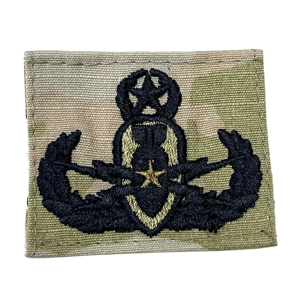 Army Master EOD Badge with military insignia on a beige background