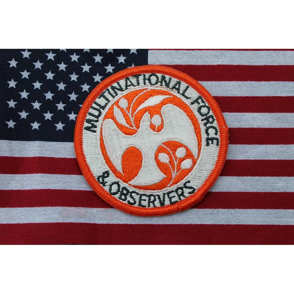 Multinational Force & Observers patch on an American flag background