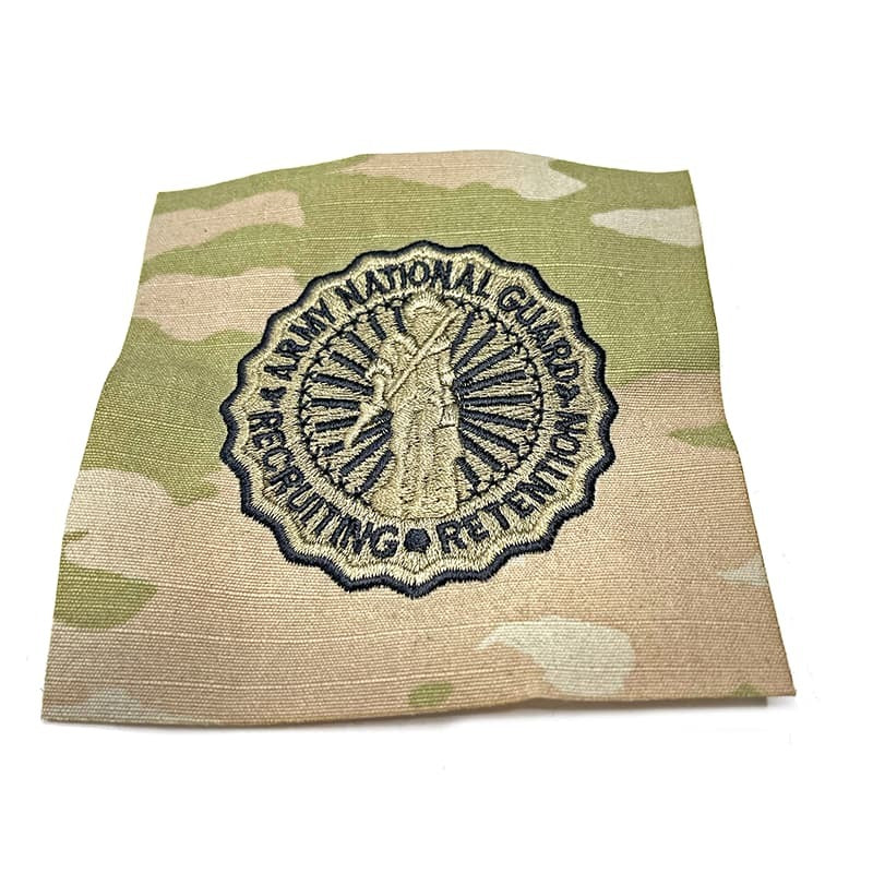 Camouflage fabric with a National Guard logo on a white background