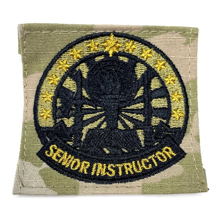 Patch with embroidered design and 'Senior Instructor' text on a green background
