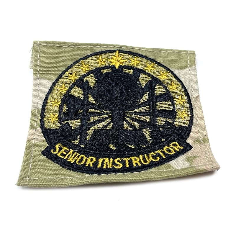 Patch with embroidered design and 'Senior Instructor' text on a green background