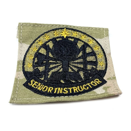 Patch with embroidered design and 'Senior Instructor' text on a green background