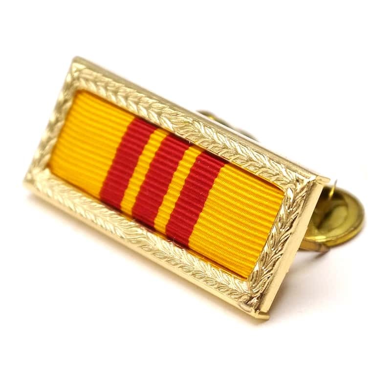 Gold military ribbon bar with yellow and red stripes on a white background