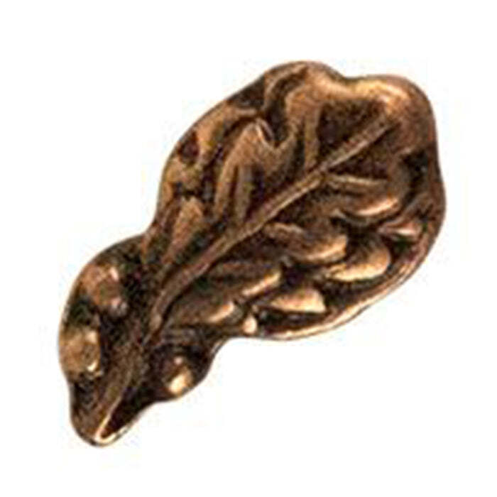 A single metallic leaf-shaped accessory, likely a brooch or pin, with an embossed leaf pattern, shown on a plain white background.