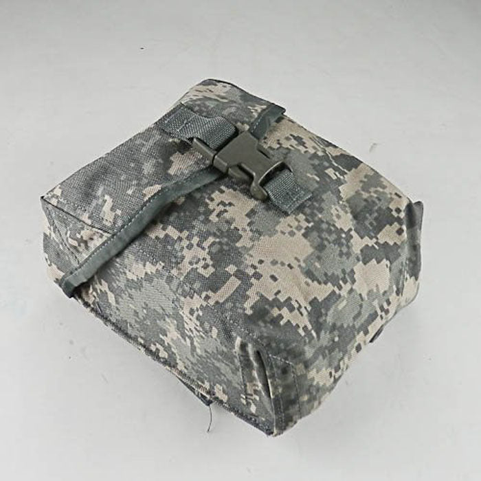 A tactical utility pouch in digital camouflage fabric, featuring a strap and plastic buckle closure, photographed on a neutral light gray background.
