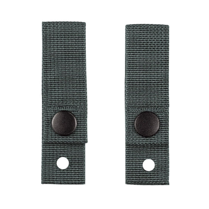 Two green webbed strap covers with black snap buttons and a hole, shown on a plain white background.