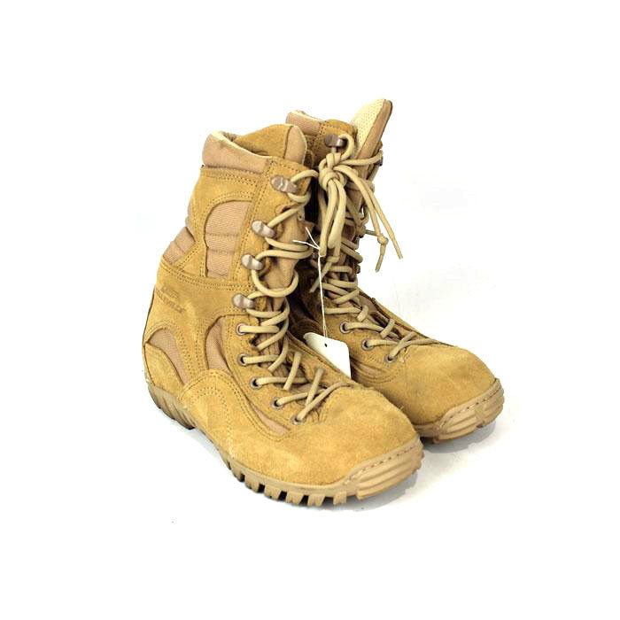 Pair of tan combat boots on a white background