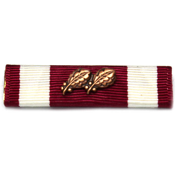 A military ribbon bar with alternating dark red and white stripes, featuring a bronze oak leaf emblem in the center, shown on a plain white background.