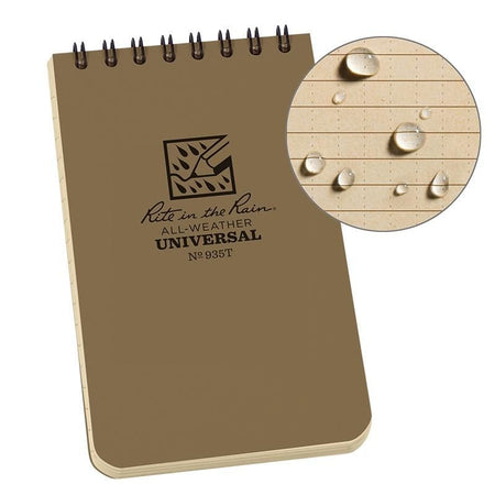 Brown notebook with 'Rite in the Rain' logo and text, showing water resistance on a wooden surface.