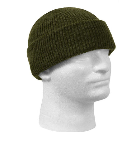 Green knit beanie on a mannequin head against a white background