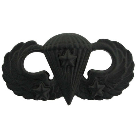 Army Basic Parachutist Badge a black metal insignia pin featuring a parachute and wings design with stars, shown on a plain white background.