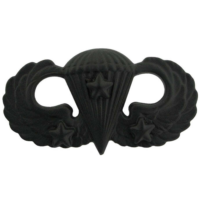 Army Basic Parachutist Badge a black metal insignia pin featuring a parachute and wings design with stars, shown on a plain white background.