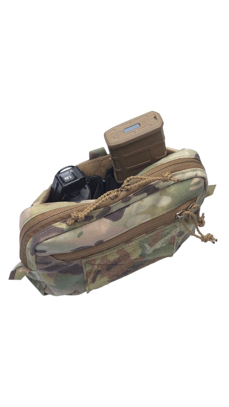A tactical utility pouch in a multi-terrain camouflage pattern, shown open with various gear items stored inside, isolated on a white background.