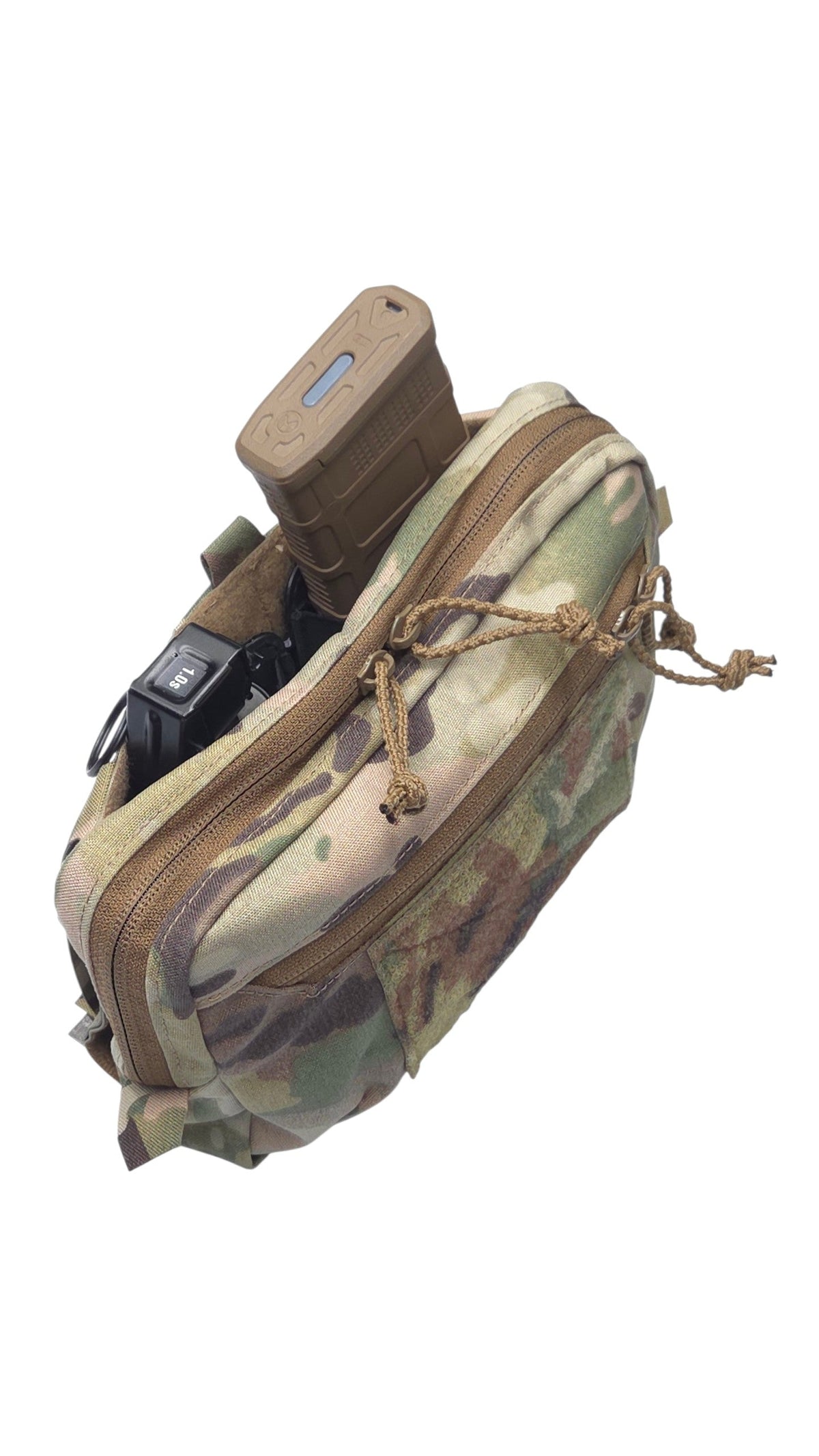 A tactical utility pouch in a Multicam camouflage pattern, shown with a tan magazine inserted into its top compartment against a plain white background.