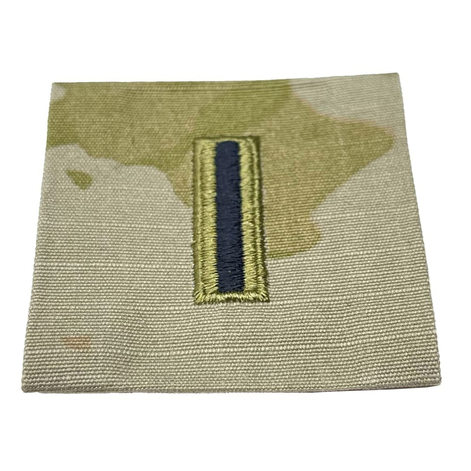 Military rank insignia patch with a single bar on a camouflage background