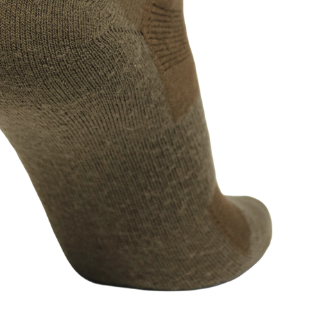 A close-up of a single knit sock in a muted taupe-brown color, showing the textured fabric and heel-to-toe shape against a plain white background.