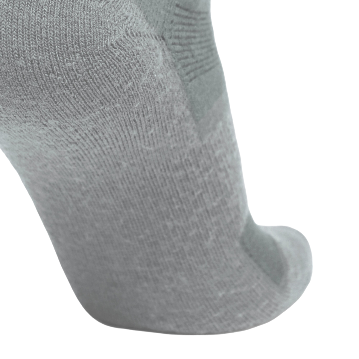 A close-up of a light gray knit sock showing the textured fabric and toe area against a plain white background.