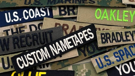 Collection of custom nametapes with various text on a camouflage background