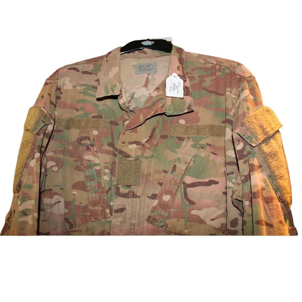 Army FRACU Jacket Flame-Resistant Combat Uniform Coat in a OCP camouflage pattern, featuring a button-up front, chest pockets, and reinforced elbow patches, shown on a hanger against a white background.