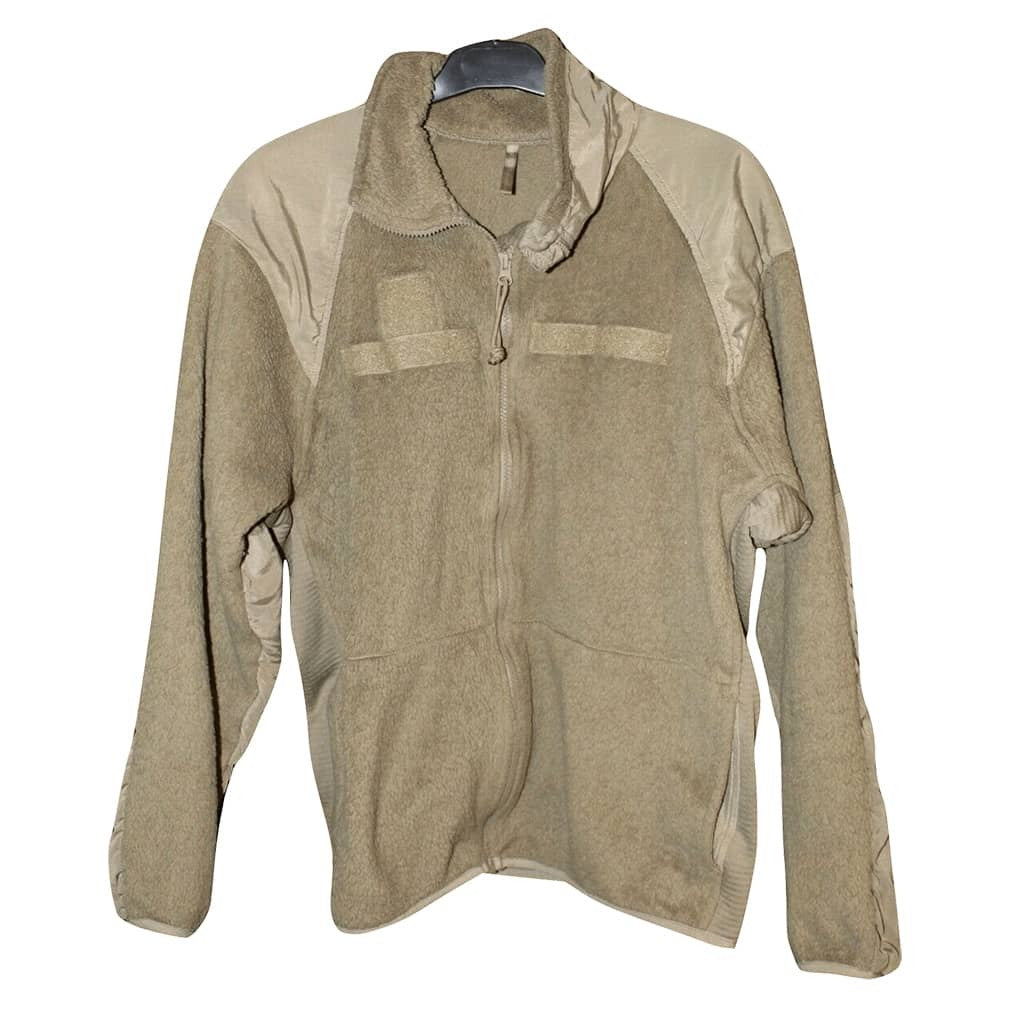 A military-style fleece jacket in a muted khaki/tan color, featuring a full zip front, a stand-up collar, and a high ribbed collar, displayed on a hanger against a white background.