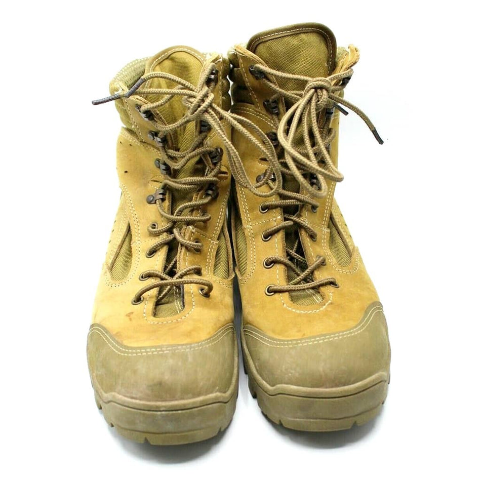 A pair of tan suede and leather lace-up work boots with heavy-duty rubber toe caps, shown against a plain white background.