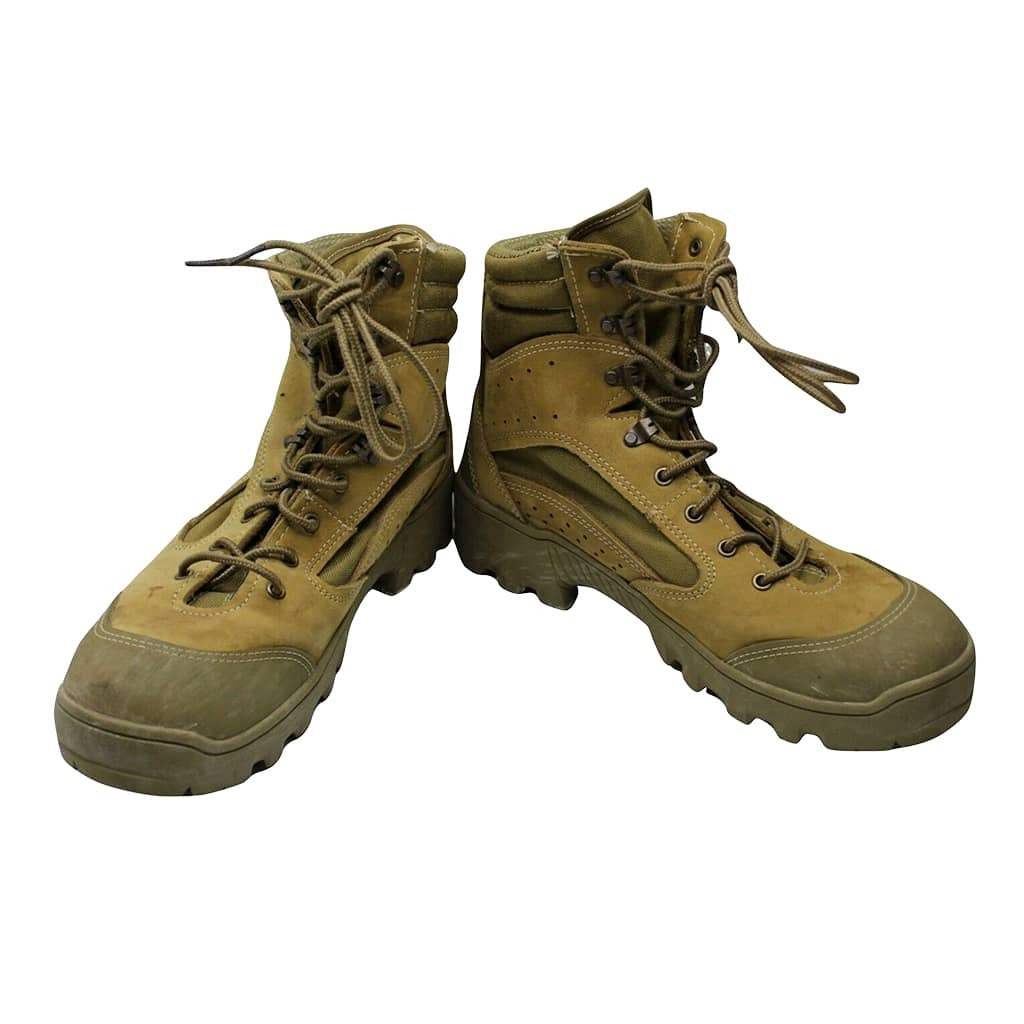 A pair of tan tactical combat boots with olive green soles and laces, shown against a plain white background.