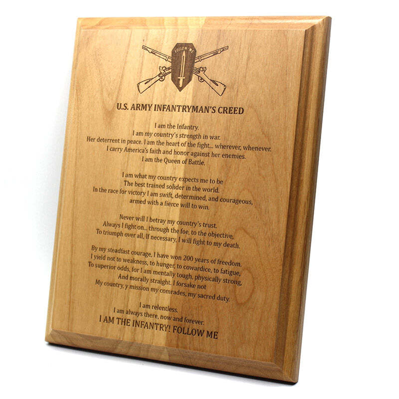 A rectangular wooden plaque with engraved text reading 'U.S.