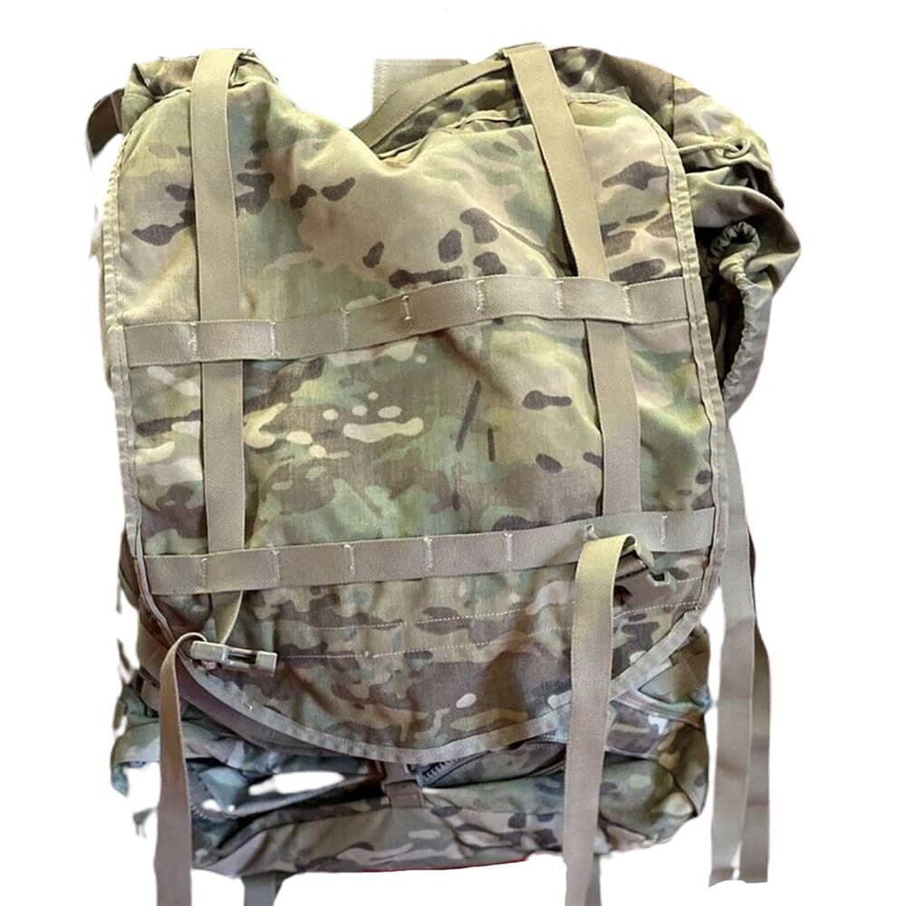 A military-style camouflage backpack shown against a plain white background. The backpack features a Multicam pattern in shades of green, tan, and brown, with tan webbing straps and buckles across the front.