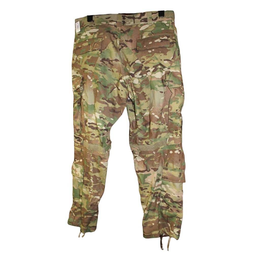 A pair of military cargo pants in a multicam camouflage pattern, featuring a mix of green, brown, tan, and beige tones. The pants are shown flat against a solid white background.