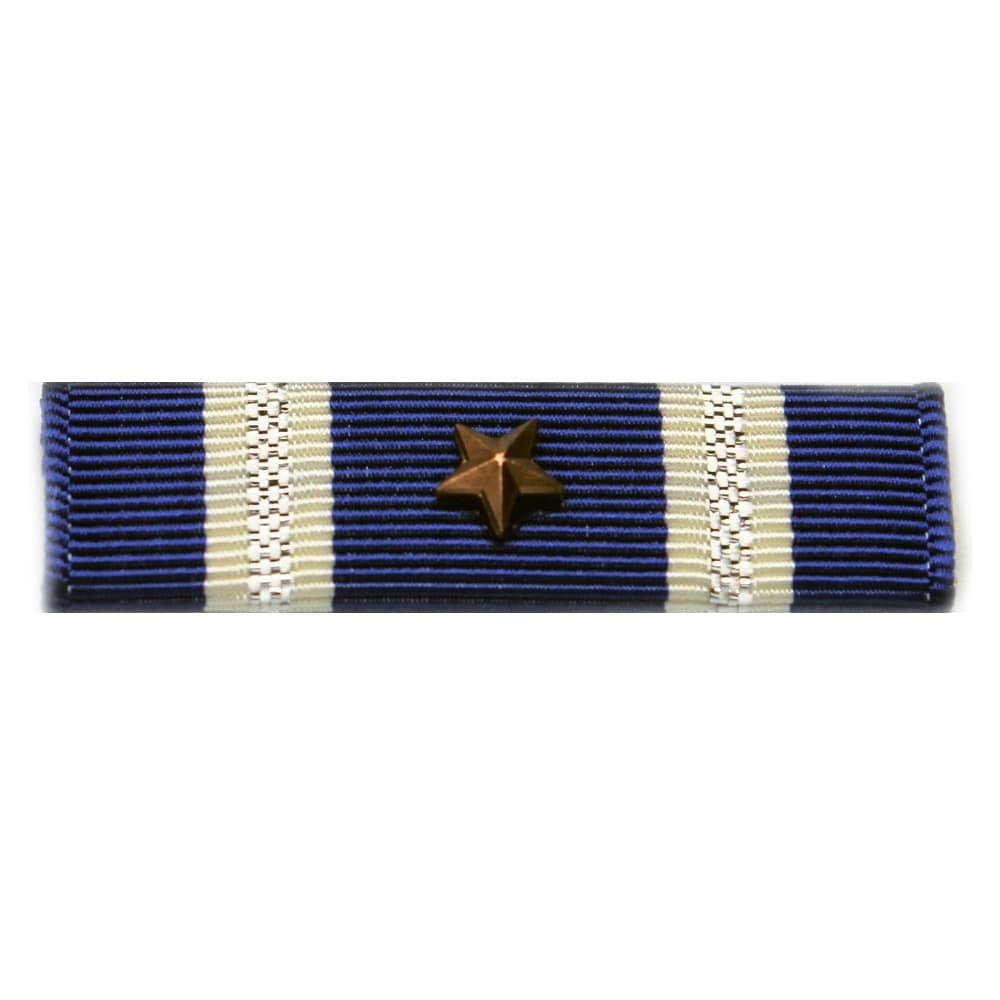 A military ribbon bar featuring dark blue and cream stripes with a central gold star, shown against a plain white background.