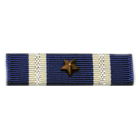 A military ribbon bar featuring dark blue and cream stripes with a central gold star, shown against a plain white background.